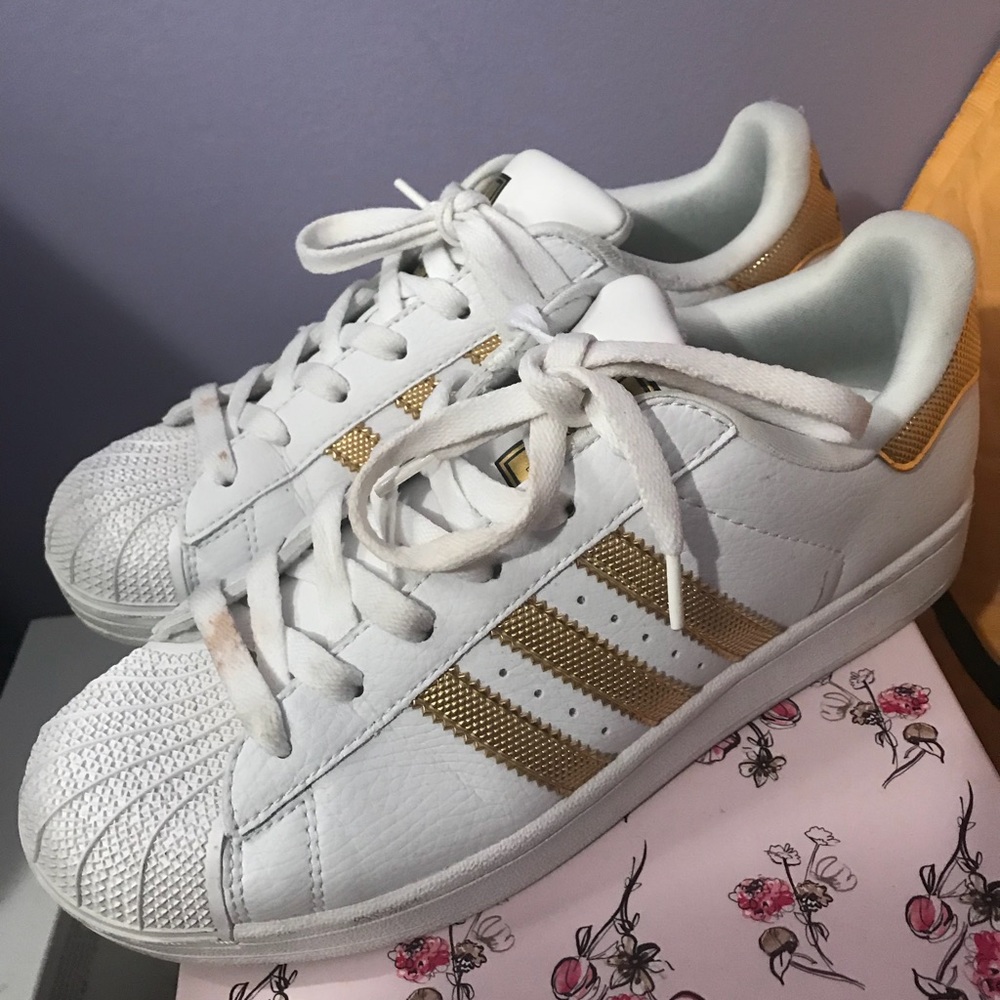 White and gold adidas shoes